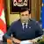 Saakashvili with a Georgian and EU flag behind him