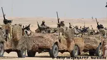 Special forces perform during the Northern Thunder military exercises in Hafar al-Batin, 500 kilometres north-east of the Saudi Capital Riyadh on March 10, 2016. Armed forces from 20 countries have begun manoeuvres in northeastern Saudi Arabia that the official Saudi Press Agency described as one of the world's biggest military exercises. Troops from Pakistan, Malaysia, Turkey, Egypt, Morocco, Jordan and Sudan are among those participating in the Thunder of the North exercise, which involves ground, air and naval forces, SPA reported.
/ AFP / FAYEZ NURELDINE (Photo credit should read FAYEZ NURELDINE/AFP/Getty Images)