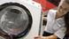 Frau mit Waschmaschine (Quelle: AP) Frau mit Waschmaschine (Quelle: AP)