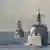 Der Zerstörer USS Mason (vorn) vor mehreren Monaten in Formation mit chinesischen und amerikanischen Kriegsschiffen