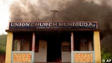 Smoke rises from a church torched by hardline Hindus in Muniguda in Phulbani District of India's Orissa state, Tuesday, Aug. 26, 2008. At least four people have been killed, including two trapped inside burning huts, when Christians clashed with Hindu mobs attacking churches in eastern India, an official said Tuesday. (AP Photo)