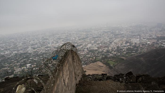 The three-meter wall separating the slums of Lima from the rest of the city