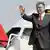 Turkish President Abdullah Gul stepping of a plane, waving