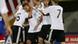 Germany's Lukas Podolski, second from left, is hugged by teammates after he scored the opening goal against Liechtenstein during their World Cup group 4 qualifying soccer match in Vaduz Germany's Lukas Podolski, second from left, is hugged by teammates after he scored the opening goal against Liechtenstein during their World Cup group 4 qualifying soccer match in Vaduz