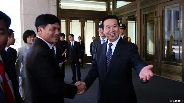 China Peking Meng Hongwei, Chinese Vice Public Security Minister, shakes hands with Nguyen Quang Dam, the commandant of the Vietnam Coast Guard, in Beijing