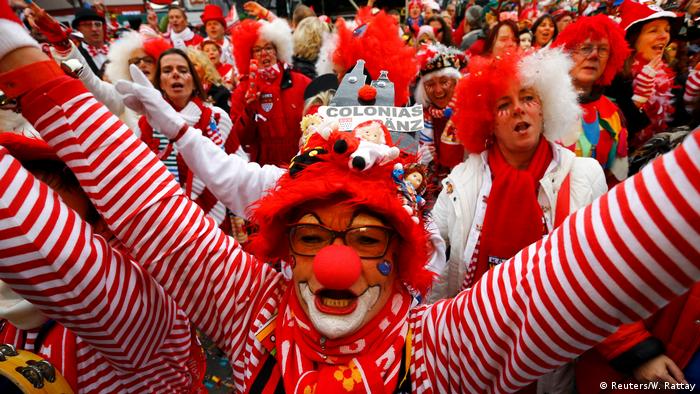 People dressed up as clowns during a Carnival celebration in Cologne