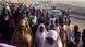 Members of the Islamic Movement of Nigeria walking on the outskirts of Kano. The Shi'ite Muslims are on a pilgrimage to Zaria. Members of the Islamic Movement of Nigeria walking on the outskirts of Kano. The Shi'ite Muslims are on a pilgrimage to Zaria.