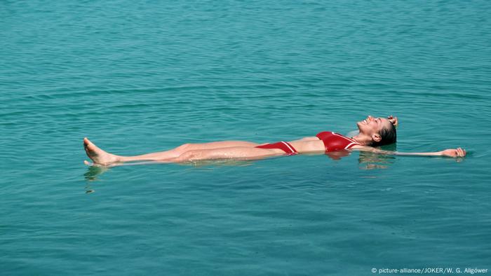 A woman floats in the Dead Sea 