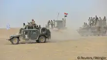 November 16, 2016.
Shi'ite fighters ride on military vehicles heading toward the airport of Tal Afar during a battle with Islamic State militants in Tal Afar west of Mosul, Iraq, November 16, 2016. REUTERS/Stringer EDITORIAL USE ONLY. NO RESALES. NO ARCHIVE.