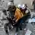 White Helmets carry a wounded person out of the rubble