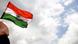 An Indian flag with clouds in the background An Indian flag with clouds in the background
