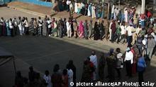 In this photo taken on Thursday Dec. 1, 2016, Gambians line up to vote for presidential elections where Opposition coalition candidate Adama Barrow faced longtime President Yahya Jammeh and third party candidate Mama Kandeh, in Banjul, Gambia. Voters in the tiny West African nation of Gambia cast marbles Thursday in an election widely expected to keep the country's ruler of more than two decades in power despite a unified challenge from the opposition. (AP Photo/Jerome Delay) |