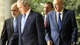 President Bush, second from left, accompanied by, from left, Federal Reserve Board Chairman Ben Bernanke, Securities and Exchange Commission (SEC) Chairman Christopher Cox, and Treasury Secretary Henry Paulson, walks out of the Oval Office of the White House in Washington, Friday, Sept. 19, 2008, to make a statement about the economy and government efforts to remedy the crisis. (AP Photo/Susan Walsh)