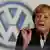German Chancellor Angela Merkel gestures during her speech at the VW general workers meeting in Wolfsburg