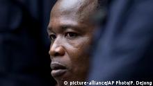 06.12.2016
Dominic Ongwen, a senior commander in the Lord's Resistance Army, whose fugitive leader Kony is one of the world's most-wanted war crimes suspects, is flanked by two security guards as he sits in the court room of the International Court in The Hague, Netherlands, Tuesday, Dec. 6, 2016. (AP Photo/Peter Dejong, Pool)
