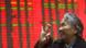 Chinese shareholders watch the price of stocks go up Chinese shareholders watch the price of stocks go up