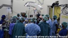 UNDATIERT *** epa05621369 An undated handout photograph provided by Kenyatta National Hospital on 07 November 2016 shows Kenyan doctors and specialists during a surgery to separate conjoined twins Blessing and Favor at the Kenyatta National Hospital in Nairobi, Kenya. Kenyatta National Hospital on 04 November 2016 announced that two-year-old conjoined twins Blessing and Favour on 01 November were successfuly separated after 23-hour surgery and were recovering well. The surgery, led by some 60 specialists including neurosurgeons and plastic surgeons, is the first of its kind in sub-Saharan Africa, the local media reported. 'The successful surgery is a testimony that the country is endowed with medical specialists who can handle complicated human health challenges such as open heart surgery, organ transplant, reconstructive surgeries and other multi-disciplinary surgeries', the hospital's Chief Executive Officer Thomas Mutie said in a statement. EPA/KENYATTA NATIONAL HOSPITAL / HANDOUT BEST QUALITY AVAILABLE HANDOUT EDITORIAL USE ONLY/NO SALES |