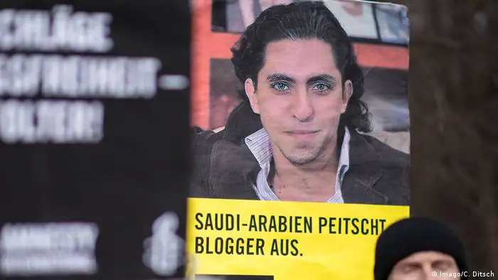 Плакат с блогером из Саудовской Аравии Раифом Бадави