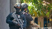January 15, 2016***
The Elite Indonesian police commando belonging to Densus 88 raids a house of a suspected terrorist in Cirebon, located in western Java island, on January 15, 2016 following the January 14, 2016 bomb attacks in Jakarta. Indonesian police launched raids across the country on January 15, 2016 in the wake of deadly coordinated attacks. The January 14, 2016 combination of suicide bombings and shootings in the capital left five attackers and two other people dead. Two dozen other people were wounded -- three foreigners, six police officers and the rest Indonesian civilians. / AFP / STRINGER (Photo credit should read STRINGER/AFP/Getty Images)