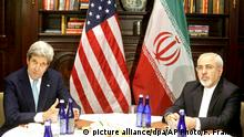 U.S. Secretary of State John Kerry, left, speaks to the media as he meets with Iranian Foreign Minister Mohammad Javad Zarif, right, Friday, April 22, 2016, in New York. (AP Photo/Frank Franklin II) |