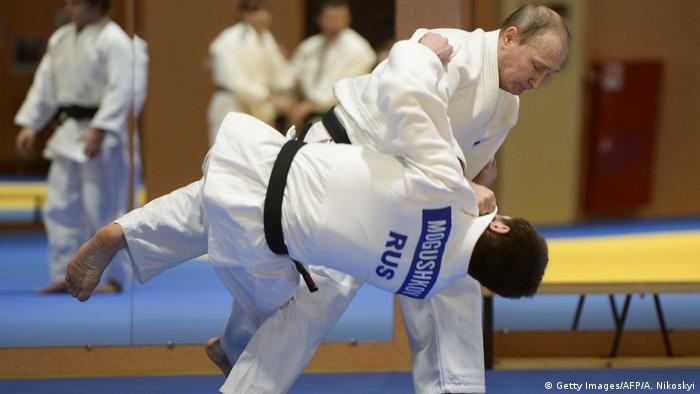 Russian President Vladimir Putin takes part in a judo training session