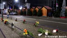 20.12.2016+++ Candles and flowers are seen near the site where a truck ploughed through a crowd at a Berlin Christmas market on Breitscheidplatz square near the fashionable Kurfuerstendamm avenue in the west of Berlin, Germany, December 20, 2016. REUTERS/Fabrizio Bensch TPX IMAGES OF THE DAY