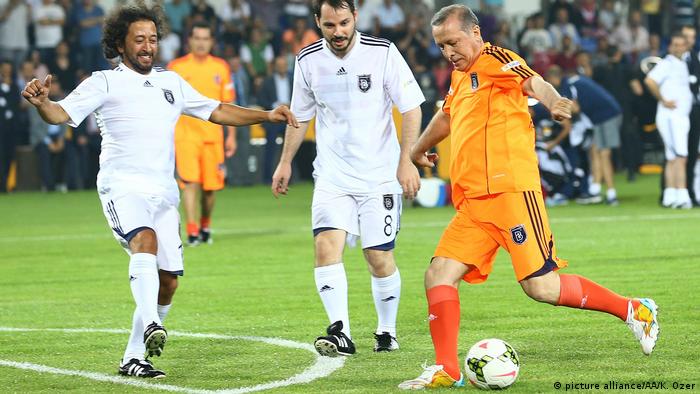 Turkish Prime Minister and Presidential Candidate Recep Tayyip Erdogan (R) in action at the exhibition match played after the opening of the football stadium named Basaksehir Fatih Terim in Istanbul, Turkey on July 26, 2014.