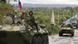 Russian soldiers sit atop armored vehicles as they cross a bridge over the Inguri River as Russian troops pull out from an area outside Georgia's breakaway province of Abkhazia Russian soldiers sit atop armored vehicles as they cross a bridge over the Inguri River as Russian troops pull out from an area outside Georgia's breakaway province of Abkhazia