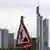 An construction sign with the Frankfurt skyline in the background