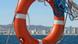 A life preserver with Barcelona in the background A life preserver with Barcelona in the background