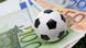 A football on some Euro notes A football on some Euro notes