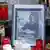 Candles and a photograph of Austrian politician Joerg Haider