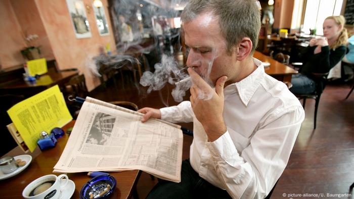 Man with a cigarette in a cafe