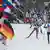 Die Biathleten Alexey Volkov aus Russland (vorne l-r), Lukas Hofer aus Italien und Erik Lesser aus Deutschland führen beim Biathlon-Weltcup in der Chiemgau Arena in Ruhpolding bei der 4 x 7,5 Kilometer-Staffel der Herren das Feld nach dem Start an (Foto: picture alliance / Sven Hoppe/dp)