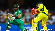 13.01.2017+++ Pakistan's batsman Mohammad Rizwan (L) pushes a ball during the one-day international cricket match between Pakistan and Australia in Brisbane on January 13, 2017. / AFP / Patrick HAMILTON / IMAGE RESTRICTED TO EDITORIAL USE - STRICTLY NO COMMERCIAL USE (Photo credit should read PATRICK HAMILTON/AFP/Getty Images)