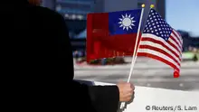 14.01.2017 *** A demonstrator holds flags of Taiwan and the United States in support of Taiwanese President Tsai Ing-wen during an stop-over after her visit to Latin America in Burlingame, California, U.S., January 14, 2017. REUTERS/Stephen Lam