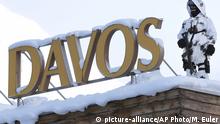 17.01.2017 **** An armed Swiss police officer stands on a roof top during the 'World Economic Forum' in Davos, Switzerland, Tuesday, Jan. 17, 2017. Business and world leaders are gathering for the annual meeting 'World Economic Forum ' in Davos. (AP Photo/Michel Euler) |