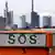 Frankfurt skyline with an SOS sign