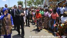 Turkey's President Recep Tayyip Erdogan and his wife Emine Erdogan greet local people during a ceremony in Maputo, Mozambique, Tuesday, Jan. 24, 2017. Erdogan has arrived in Mozambique on an Africa tour in which he is promoting trade and asking governments to crack down on schools and other institutions linked to Fethullah Gulen, a Muslim cleric accused of organizing a coup attempt in Turkey last year.( Kayhan Ozer/Pool Photo via AP) |