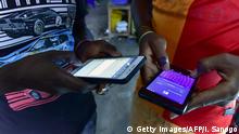 People browse internet articles the new version of Facebook in the popular West African language Peule on September 30, 2016 in Abidjan. / AFP / ISSOUF SANOGO (Photo credit should read ISSOUF SANOGO/AFP/Getty Images)