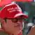 A man wears a 'Make America Great Again' cap