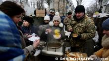 Ukrainian servicemen serve hot food to local residents in the flashpoint eastern town of Avdiivka, in the Donetsk region on February 2, 2017.
Ukraine's president appealed for more global pressure against Russia as Moscow-backed rebels and government forces clashed around a frontline town in a surge of fighting that has claimed a reported 23 lives. / AFP / Alexey FILIPPOV (Photo credit should read ALEXEY FILIPPOV/AFP/Getty Images)