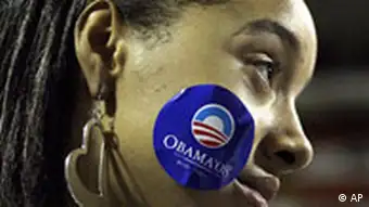 A young woman wears an Obama campaign sticker on her cheek