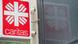 A sign for the Catholic relief organization Caritas A sign for the Catholic relief organization Caritas
