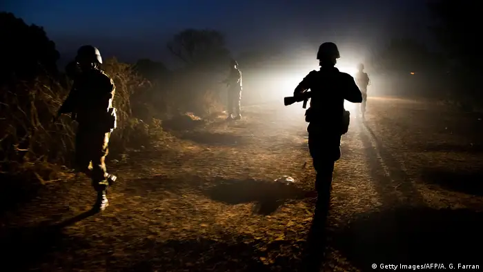 UN troops patrolling at night. (Getty Images/AFP/A. G. Farran)