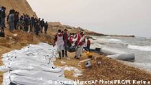 This Monday, Feb. 20, 2017 photo provided by The International Federation of Red Cross and Red Crescent Societies (IFRC), shows Libyan Red Crescent workers recovering bodies of people that washed ashore, near Zawiya, Libya. The Libyan Red Crescent says at least 74 bodies of African migrants have washed ashore in western Libya, the latest tragedy at sea along a perilous trafficking route to Europe. It says the bodies were found on Monday, and that more may yet surface. (Mohannad Karima/IFRC via AP) |