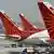 Passenger jets from Air India, India's national carrier, stand at Indira Gandhi International Airport