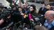 Anas M., who became the victim of an anti-refugee smear campaign on Facebook after taking a selfie with Chancellor Angela Merkel, speaks to reporters outside a courthouse in Bavaria. Anas M., who became the victim of an anti-refugee smear campaign on Facebook after taking a selfie with Chancellor Angela Merkel, speaks to reporters outside a courthouse in Bavaria.