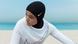 A woman poses in a Nike hijab in an undate photo released by the company A woman poses in a Nike hijab in an undate photo released by the company