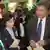 Эльвира Набиуллина и премьер-министр земли Баден-Вюртемберг Гюнтер Эттингер осматривают сибирский стенд на ярмарке GlobalConnect